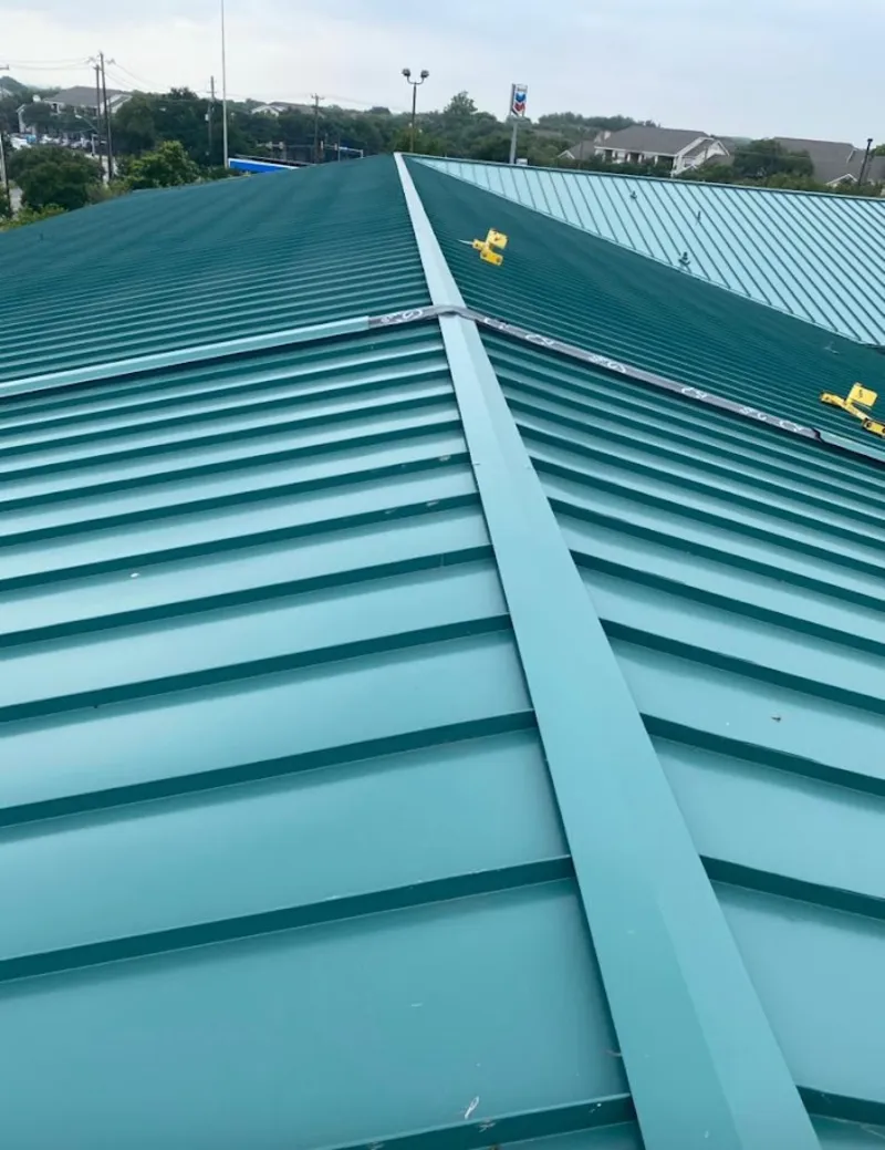 Green commercial metal roof ridge and valley for Metal Roof Repair in Newbury